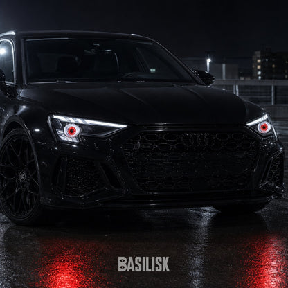 Audi RS3 at night with BASILISK demon eyes lit in both headlights